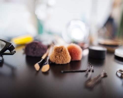 Various beauty products on table in studio